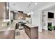 Modern kitchen with granite countertops, stainless steel appliances and island at 7545 Roseberry Way, Lithonia, GA 30038