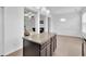 Kitchen island with granite countertops, seating space, and modern pendant lighting at 7545 Roseberry Way, Lithonia, GA 30038