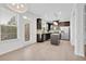 Eat-in kitchen with stainless steel appliances, granite countertops, island and access to the outdoor area at 7545 Roseberry Way, Lithonia, GA 30038