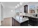 Kitchen with granite countertops, an island, stainless steel appliances, and an access to an outdoor area at 7545 Roseberry Way, Lithonia, GA 30038