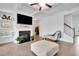Comfortable living room with a fireplace, hardwood floors, neutral decor, and a coffered ceiling at 7545 Roseberry Way, Lithonia, GA 30038