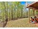 A sprawling backyard features a well-maintained lawn with an orange riding mower at 7801 Windswept Way, Douglasville, GA 30135