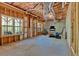 Unfinished basement with exposed ductwork, two windows, and concrete flooring at 7801 Windswept Way, Douglasville, GA 30135