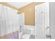 Standard bathroom features a shower-tub combination and toilet at 7801 Windswept Way, Douglasville, GA 30135