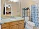 Cozy bathroom featuring a vanity with a mirror and a shower-tub combination at 7801 Windswept Way, Douglasville, GA 30135