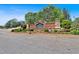 The Estates at Hurricane Pointe entrance is marked by a brick sign and manicured landscaping at 7801 Windswept Way, Douglasville, GA 30135