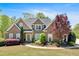 Charming brick home with a manicured lawn and inviting curb appeal at 7801 Windswept Way, Douglasville, GA 30135
