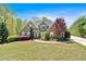 Well-maintained home featuring a beautiful lawn and mature trees at 7801 Windswept Way, Douglasville, GA 30135