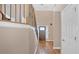 Elegant foyer featuring hardwood floors, a staircase, and natural light at 7801 Windswept Way, Douglasville, GA 30135