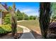 Well-manicured front yard features a pathway through landscaped garden beds at 7801 Windswept Way, Douglasville, GA 30135