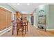 A cozy eat-in kitchen with wooden cabinetry, hardwood floors, and natural light at 7801 Windswept Way, Douglasville, GA 30135