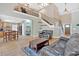 Open-concept living area with hardwood floors and staircase at 7801 Windswept Way, Douglasville, GA 30135