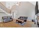 Spacious living room with high ceilings, hardwood floors, and fireplace at 7801 Windswept Way, Douglasville, GA 30135