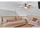 Cozy living room with a vaulted ceiling, comfortable seating, and a ceiling fan at 7801 Windswept Way, Douglasville, GA 30135