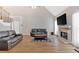Bright living area featuring a fireplace, hardwood floors, and vaulted ceiling at 7801 Windswept Way, Douglasville, GA 30135