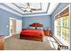 Main bedroom with ceiling fan, hardwood floors, window view and access to ensuite bath at 7801 Windswept Way, Douglasville, GA 30135