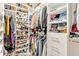 Organized walk-in closet with shelves, hanging rods, and shoe storage at 7801 Windswept Way, Douglasville, GA 30135
