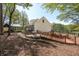 Scenic view of home exterior and backyard featuring a wooden bridge and patio area at 8132 Union Hill Rd, Canton, GA 30115