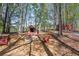 Outdoor backyard area with fire pit, chairs, and decorative sheds at 8132 Union Hill Rd, Canton, GA 30115