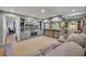 Basement lounge area featuring a large TV, a bar, and comfortable seating at 8132 Union Hill Rd, Canton, GA 30115