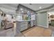 Basement bar with a wine fridge, unique granite countertops, and custom cabinets at 8132 Union Hill Rd, Canton, GA 30115