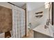 Bathroom featuring a white vanity, framed mirror, tile shower and shelves at 8132 Union Hill Rd, Canton, GA 30115