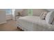 Bedroom with neutral walls, plush carpet, dresser, and bright windows at 8132 Union Hill Rd, Canton, GA 30115