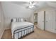 Bedroom featuring neutral walls, plush carpet, ceiling fan, and bright windows at 8132 Union Hill Rd, Canton, GA 30115