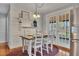 Dining area with shiplap walls, farmhouse table, and French doors leading to the outdoors at 8132 Union Hill Rd, Canton, GA 30115