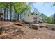Home exterior view with backyard, wooden bridge, and a relaxing hot tub at 8132 Union Hill Rd, Canton, GA 30115