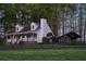 Picturesque two-story home featuring a welcoming front porch and beautifully landscaped yard at 8132 Union Hill Rd, Canton, GA 30115