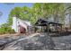 Charming home with a covered parking area, front porch, and well-maintained landscaping at 8132 Union Hill Rd, Canton, GA 30115