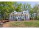Inviting home with a spacious front porch, perfect for relaxing and enjoying the outdoor scenery at 8132 Union Hill Rd, Canton, GA 30115
