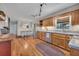 Bright kitchen with wood cabinets, stainless appliances, and a dining area with farmhouse decor at 8132 Union Hill Rd, Canton, GA 30115