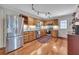 Traditional kitchen featuring wood cabinets, stainless steel appliances, and hardwood floors at 8132 Union Hill Rd, Canton, GA 30115