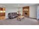 Cozy living room with a classic brick fireplace and a comfortable leather sofa at 8132 Union Hill Rd, Canton, GA 30115
