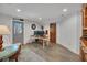Basement office space featuring a desk, white-washed brick, and outside access at 8132 Union Hill Rd, Canton, GA 30115