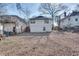 Large backyard featuring a gated fence, gravel area, and access to the home's back entrance at 1415 Eric Se St, Atlanta, GA 30315
