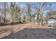 Expansive backyard with mature trees and fencing, offering a serene and private outdoor space for relaxation and recreation at 1415 Eric Se St, Atlanta, GA 30315