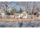 Charming home with a well-maintained front yard, brick pillars, and a classic white picket fence at 1415 Eric Se St, Atlanta, GA 30315