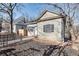 View of a single-story home featuring a fenced yard, landscaping, and charming curb appeal at 1415 Eric Se St, Atlanta, GA 30315