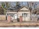 Charming single-story home featuring a fenced yard, mature trees, and welcoming front entrance at 1415 Eric Se St, Atlanta, GA 30315