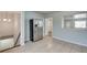 Bright kitchen features stainless steel fridge and tile flooring at 1415 Eric Se St, Atlanta, GA 30315