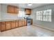 Functional kitchen with oak cabinets and tiled floor at 1415 Eric Se St, Atlanta, GA 30315