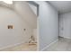 Functional laundry area with tile flooring, washer and dryer connections, and nearby storage under the stairs at 1415 Eric Se St, Atlanta, GA 30315