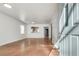 Bright living room with hardwood floors, neutral walls, and a view into the kitchen at 1415 Eric Se St, Atlanta, GA 30315