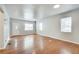 Bright living room with hardwood floors, fresh neutral paint, and natural light from multiple windows at 1415 Eric Se St, Atlanta, GA 30315
