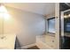 Bathroom featuring a jacuzzi tub, tiled shower, window, and vanity with double sinks at 2331 Bouldercliff Se Way, Atlanta, GA 30316
