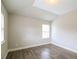 Bedroom with natural light, tray ceiling, and wood flooring at 2331 Bouldercliff Se Way, Atlanta, GA 30316