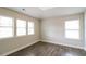 Bedroom with natural light, tray ceiling, and wood flooring at 2331 Bouldercliff Se Way, Atlanta, GA 30316